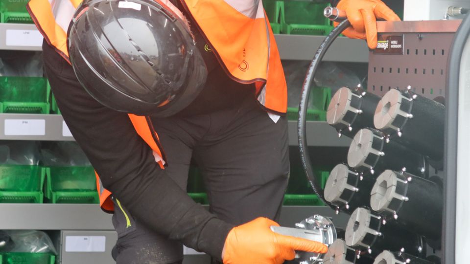 hydraulic engineer working on coupling